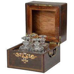 an old fashioned wooden box filled with glasses