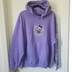 Excellent Condition. Worn Once, Washed And Air Dried (No Dryer Shrinking) Super Soft Hoodie With Cozy Inner Fleece Lining. 100% Cotton Drawstring Hood Front Pouch Pocket Long Sleeves Ribbed Cuffs And Hem Fleece Fabrication Interior Part Of The Disney100 Celebration Collections Join Mickey And His Friends As They Celebrate The 100th Anniversary Of The Walt Disney Company In Style On This Comfy Purple Pullover Hoodie From The Happiest Place On Earth. With Its Embroidered Disney100 Logo With Mickey Disney Merchandise Clothing, Purple Pullover, Walt Disney Company, 100th Anniversary, Happiest Place On Earth, Soft Hoodie, Disney Merchandise, Disneyland Resort, Disney Tops