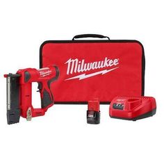 the milwaukee cordless driller is set up in front of a red case with tools