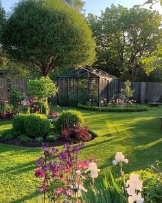 a garden with lots of flowers and trees