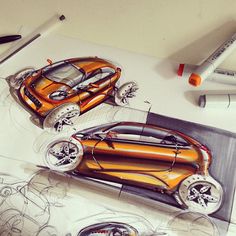 a drawing of two orange cars on top of a white table next to markers and pens