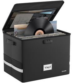 a record player with vinyl records in it's storage box, on a white background