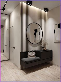 a black and white room with a round mirror on the wall