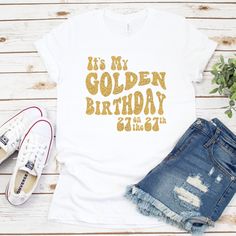 "It's time to celebrate! Introducing the \"Golden Birthday Glam\" Tee - the perfect way to shine on your special day! Crafted with celebration in mind, this dazzling shirt is more than just fabric; it's a statement of style and joy. Made from high-quality cotton, our Golden Birthday Tee feels as good as it looks. The shirt features a glimmering gold glitter vinyl design that proudly announces, \"It's my golden birthday!\" along with your age. The golden hues reflect the radiance of your mileston Golden Birthday Ideas For Women, Golden Birthday Outfit Women, Golden Birthday Shirt, Golden Birthday Party Ideas, Golden Birthday Gifts, Golden Bday, Golden Birthday Parties, It's My Birthday Shirt, Birthday Glam