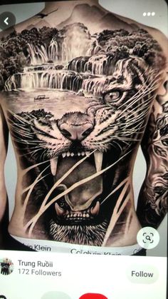 the back of a man's chest with an image of a tiger and waterfall