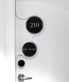 the door is white and has black numbers on each side, along with two round buttons that read 2160 for me