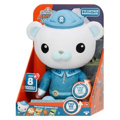 a small white teddy bear in a blue outfit with a fireman's hat