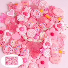 a pile of pink and white heart shaped buttons