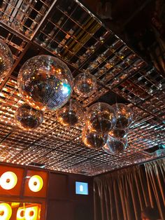 disco balls are hanging from the ceiling in this room