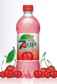 a bottle of 7up water with cherries around it