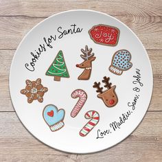 a white plate topped with lots of decorated cookies