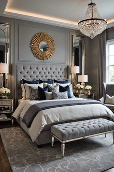 a bedroom with a large bed and chandelier