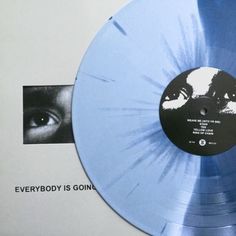 a blue vinyl record with an image of a man's face on it and the words everybody is going