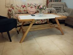 a living room with a couch, chair and coffee table