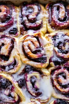 blueberry cinnamon rolls with icing in a baking dish