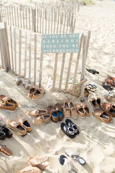 there are many pairs of shoes on the beach