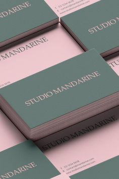 several business cards stacked on top of each other with the words studio mandarinne in white