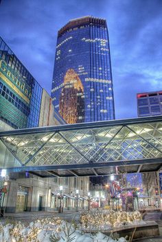 the city skyline is lit up at night