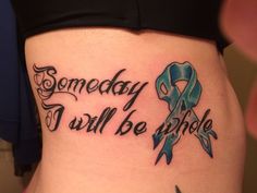 a woman with a tattoo on her stomach that says, somebody i will be whole