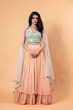 Peach Lehenga Set with Mirror Work Choli and Dupatta - Anvi Couture Orange Sharara For Wedding, Elegant Orange Sets For Navratri, Orange Traditional Drape Palazzo Set For Wedding, Orange Wedding Palazzo Set With Traditional Drape, Wedding Orange Palazzo Set With Traditional Drape, Orange Georgette Sets For Reception, Orange Cutdana Sets For Reception, Peach Palazzo Set With Resham Embroidery, Peach Anarkali Set For Reception With Traditional Drape