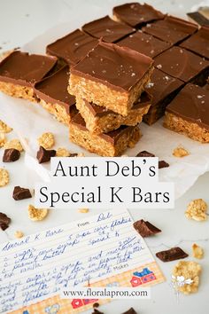 chocolate and peanut butter bars stacked on top of each other with the words, ann deb's special k bars