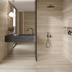 a modern bathroom with wooden walls and flooring