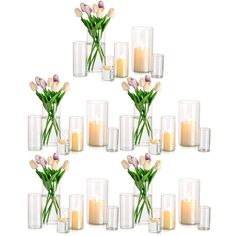 there are many vases with flowers and candles in them