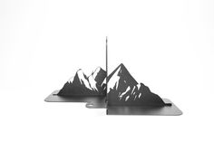 two metal mountains are shown against a white background