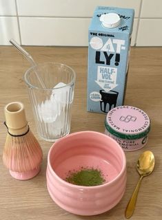 the ingredients to make an ice cream recipe are displayed on a table with spoons