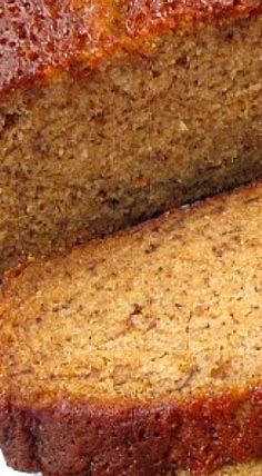 sliced loaf of banana bread sitting on top of a white plate