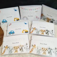 six children's books with animals on them sitting on a white rug in front of a wooden table