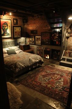 a bed sitting in the middle of a room next to a rug and lamps on either side of it