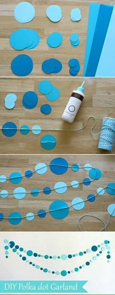 blue polka dot garland is hanging on the floor with tape and scissors next to it