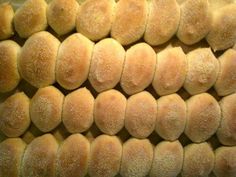 bread rolls lined up on top of each other