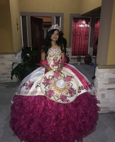 a woman in a dress that is made to look like a princess with flowers on it