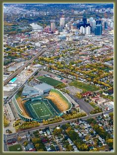 an aerial view of a football stadium in the city