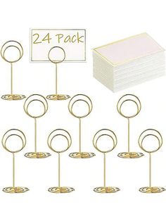 twelve gold ring place cards holders with 24 packs of each one for each individual guest