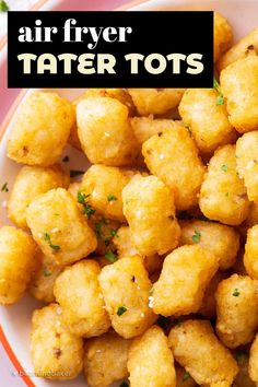 air fryer tater tots in a white bowl with parsley on top