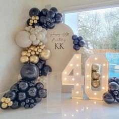 balloons are arranged in the shape of letters and numbers for an anniversary celebration at home