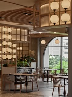 an empty restaurant with tables and chairs in front of a large window that looks out onto the city