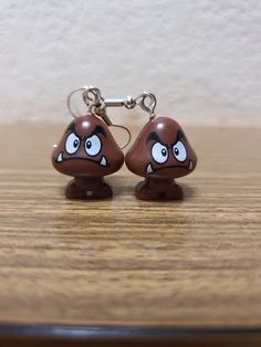 Get your Goomba's! These little critters are everywhere. Fun, unique, quirky and down right beautiful these statement earrings are a definite talking point!  Made using a minifigure a silver wire hoop and a rubber stopper. Simple and effective but guaranteed to get noticed! Sound Machine, Retro Earring, Little Critter, Stainless Steel Wire, Super Mario, Silver Wire, Mini Figures, Statement Earrings, Jewelry Earrings Dangle