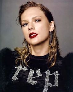 a woman with long hair and red lipstick