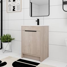 a bathroom with a sink, mirror and rugs on the floor in front of it