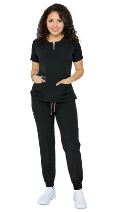 Be ready to impress the second you put on Dress A Med's Soft Stretch Silver Zipper jogger set. This 2 piece uniform scrubs set is ultra-flattering with its accent silver zipper neckline. You'll be sure to show off your figure while still maintaining your trusted and professional image. This uniform soft stretch scrubs set is made to be dazzling as you are with its accentuating double stitch lines. The scrub top is modern yet ultra-useful with a zipper compartment and 2 large pockets. The jogger Cute Nursing Outfits Scrubs, Cute Nursing Outfits, Nurses Uniform Modern, Nursing Scrubs Pattern, Nurse Outfits, Scrubs Fashion, Medical Scrubs Fashion, Scrubs Pattern, Cute Scrubs