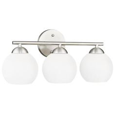 three light bathroom fixture with white glass globes on the sides and an arm in brushed steel finish