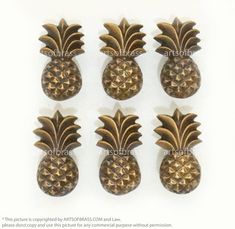 six brass pineapples are shown on a white background with the words, there is no image here to provide a caption for