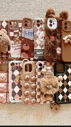 there are many cell phones and teddy bears on the floor with one bear sticking out of it's back