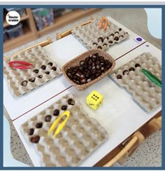 a table topped with lots of trays filled with eggs and other items on top of it