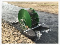 a large green machine is in the water