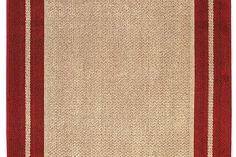 a red and beige rug with stripes on the bottom, in front of a white background